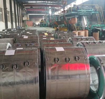 Many coils of galvanized steel packaged in the warehouse, there are large coils and small coils.