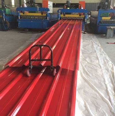 It shows the production process of the red corrugated roofing sheets, one piece is being produced.
